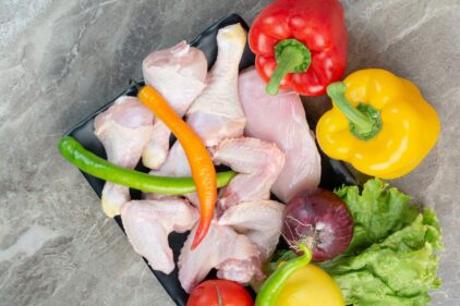 fresh raw chicken with vegetables